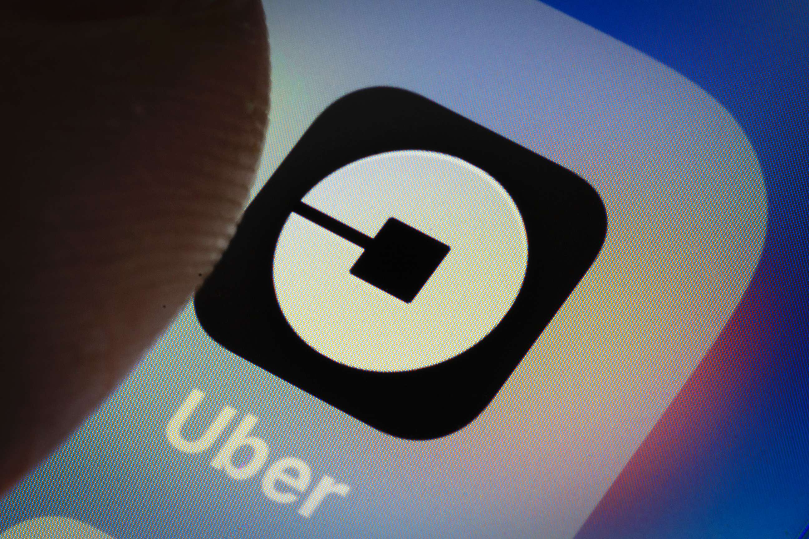 PHOTO: The Uber app logo is displayed on a smartphone on March 20, 2018 in Berlin.