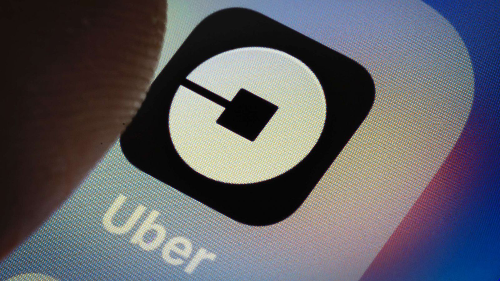 PHOTO: The Uber app logo is displayed on a smartphone on March 20, 2018 in Berlin.