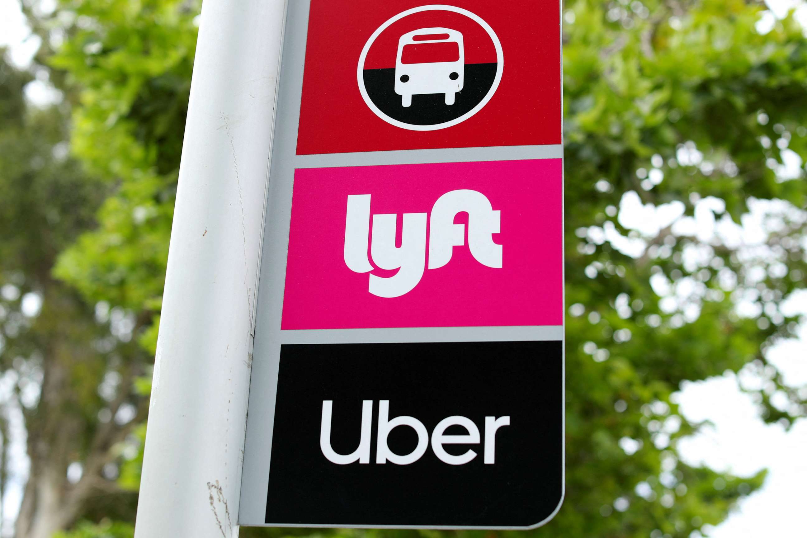 PHOTO: In this file photo, a sign marks a rendezvous location for Lyft and Uber users at San Diego State University in San Diego, California, U.S., May 13, 2020.