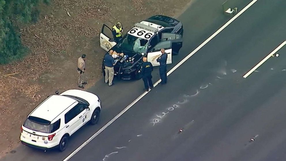 PHOTO: Police at the scene in Encino, Calif., after an Uber passenger was fatally struck by patrol vehicle after jumping median and = running across Highway 101, Oct. 14, 2019.