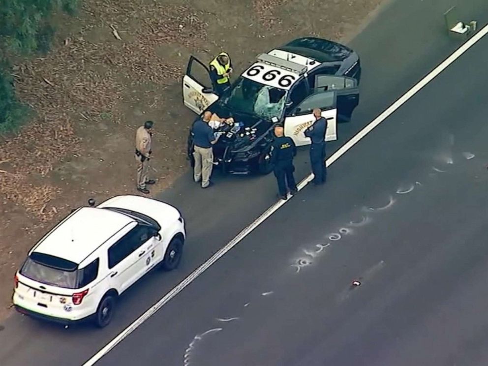 PHOTO: Police at the scene in Encino, Calif., after an Uber passenger was fatally struck by patrol vehicle after jumping median and = running across Highway 101, Oct. 14, 2019.