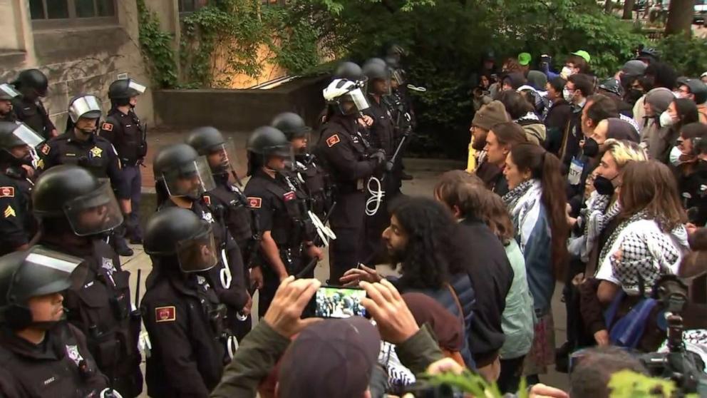 PHOTO: Protesters face off with police at an encampment at the University of Chicago, Tuesday, May 7, 2024.