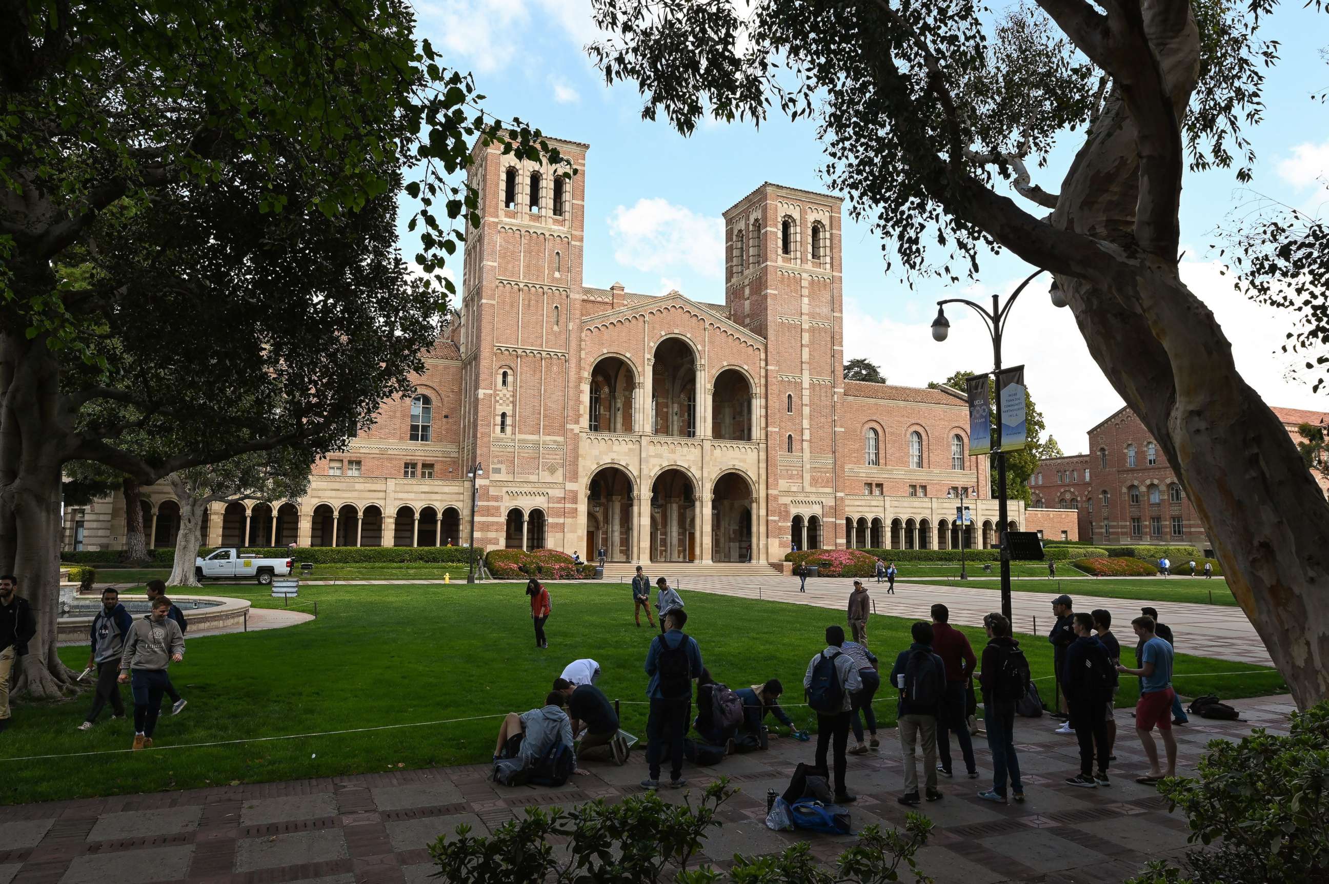 PHOTO: Students gather near Royce Hall on the campus of UCLA, Mar. 11, 2020, in Los Angeles. 