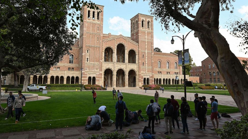 PHOTO: Students gather near Royce Hall on the campus of UCLA, Mar. 11, 2020, in Los Angeles. 