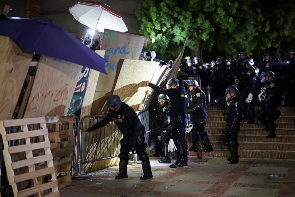 PHOTO: Riot police take down the barricade as protesters supporting Palestinians in Gaza gather at an encampment at the University of California Los Angeles, May 2, 2024.