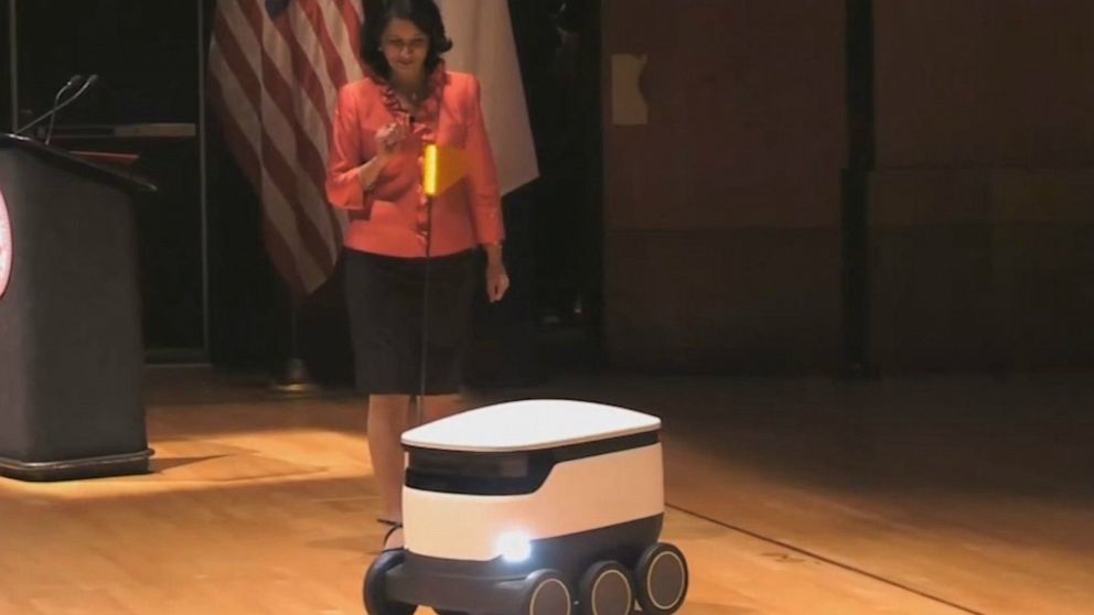 PHOTO: University of Houston President Renu Khator demonstrates an autonomous food delivery robot during her annual fall address, Sept. 2, 2019.
