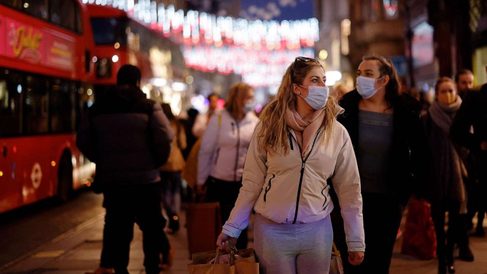PHOTO: Shoppers wear face masks along Oxford Street in central London on Dec. 2, 2021, as compulsory mask wearing in shops and on public transport has been reintroduced in England.