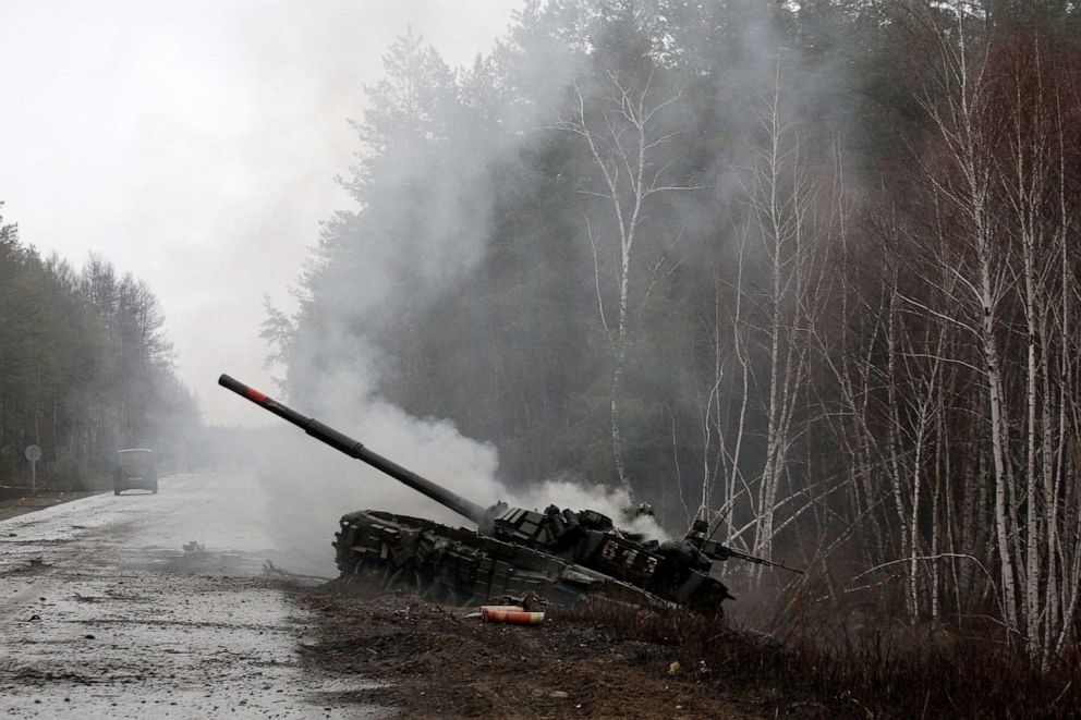 PHOTO: Smoke rises from a Russian tank destroyed by the Ukrainian forces on the side of a road in Lugansk region on Feb. 26, 2022.