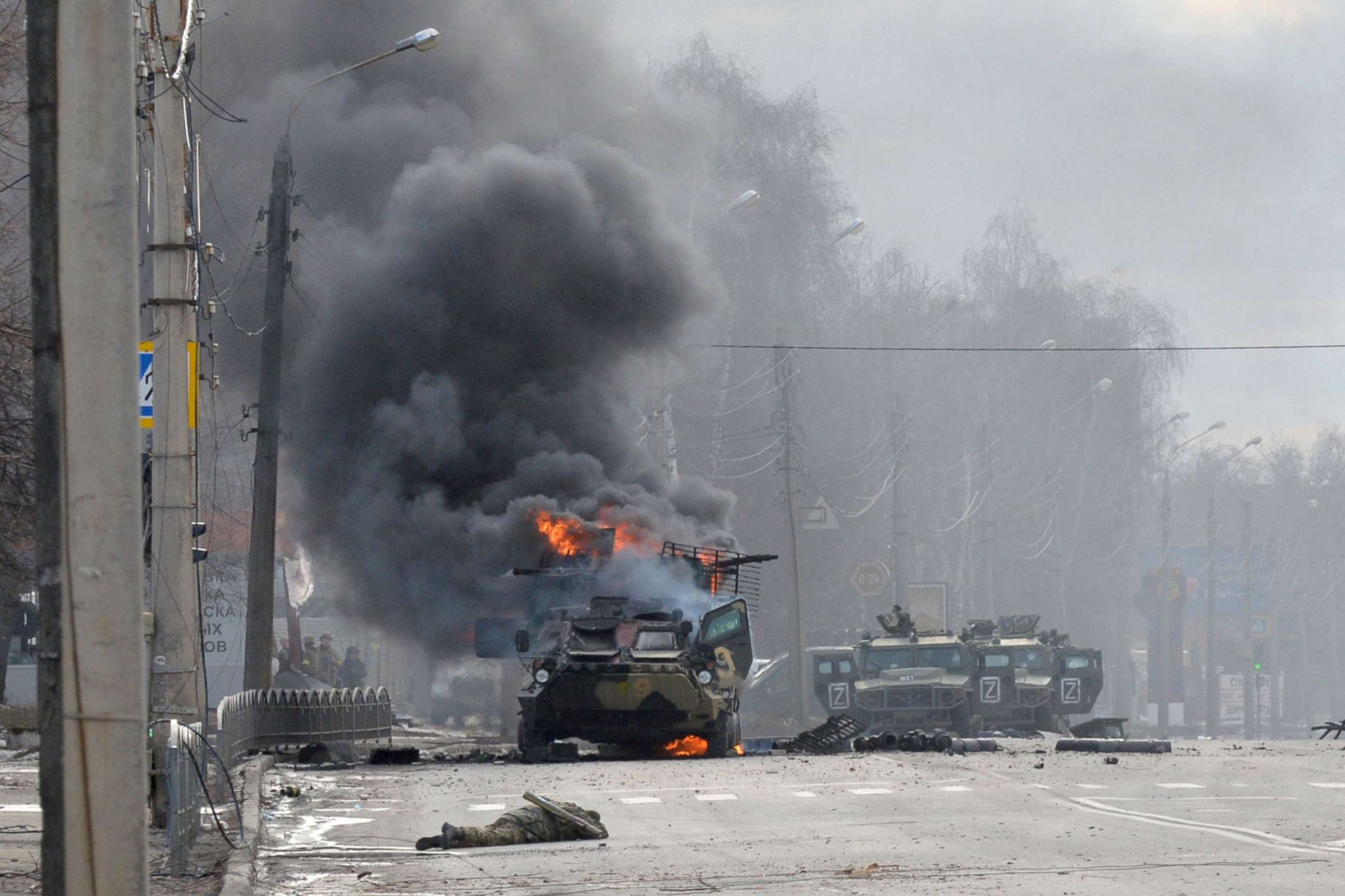 PHOTO: A Russian Armoured personnel carrier burns during a fight with the Ukrainian armed forces in Kharkiv, Feb. 27, 2022.