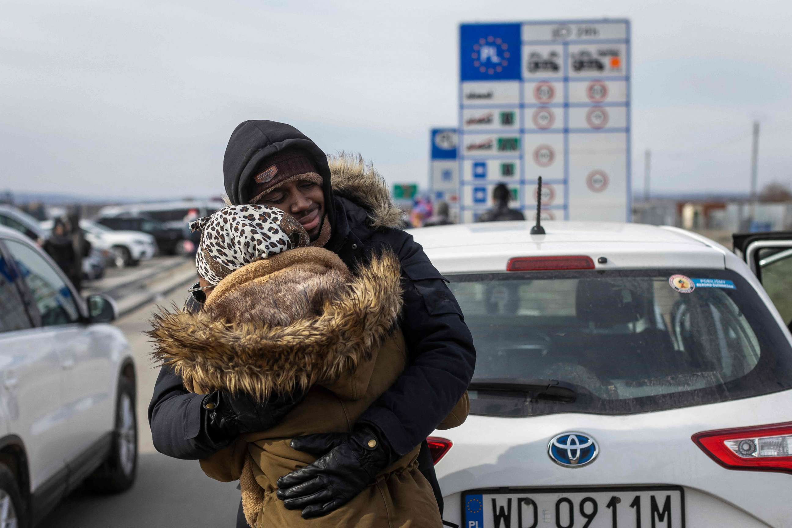 PHOTO: Refugees arriving from Ukraine embrace at the border crossing in Medyka, eastern Poland on March 1, 2022.