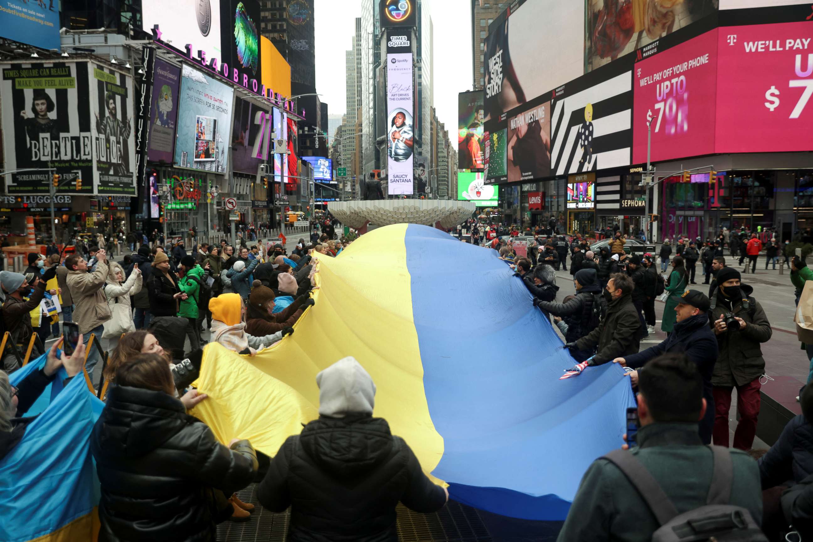 PHOTO: People take part in a protest against Russia's military operation in Ukraine, in Times Square, in New York, Feb. 24, 2022.