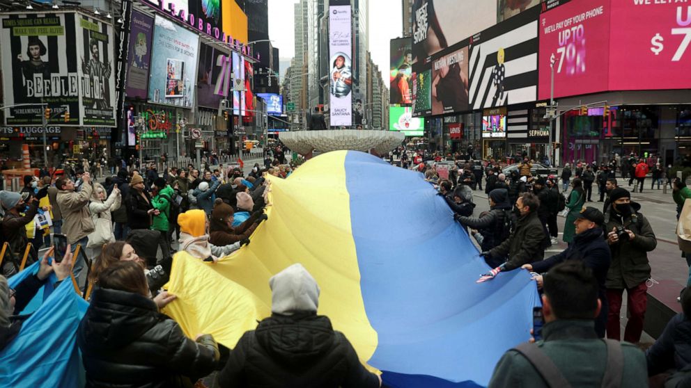 PHOTO: People take part in a protest against Russia's military operation in Ukraine, in Times Square, in New York, Feb. 24, 2022.