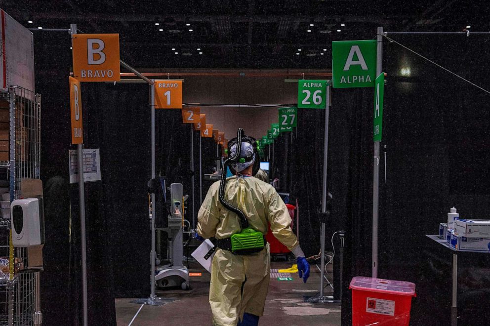 PHOTO: Inside the hot zone medical staff monitor and treat sick patients infected with the Covid-19 virus at the UMASS Memorial DCU Center Field Hospital in Worcester, Massachusetts, Jan. 13, 2021.