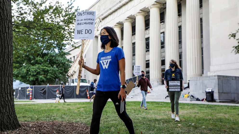 PHOTO: Members of the Graduate Employees' Organization Local 3550 protest outside of Angell Hall on the University of Michigan campus in Ann Arbor, Mich., Sept. 11, 2020.