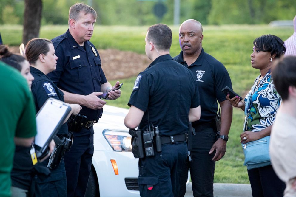 PHOTO: People gather across from the campus of UNC Charlotte after a shooting incident at the school, April 30, 2019, in Charlotte, N.C.