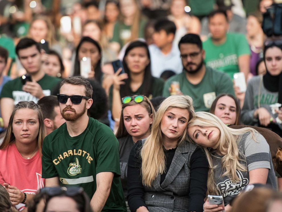 PHOTO: UNC Charlotte students participate in a vigil on campus. One day, an armed man killed two people and wounded four others on May 1, 2019 in Charlotte, North Carolina.