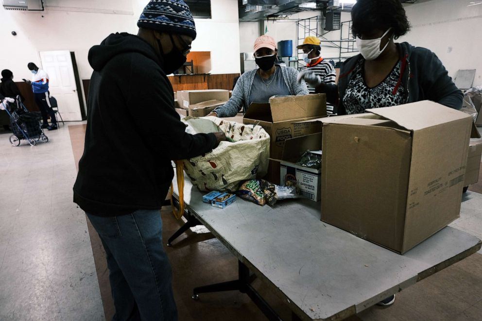 PHOTO: People receive food at a distribution site at a Bronx church on Oct. 17, 2020, in New York.