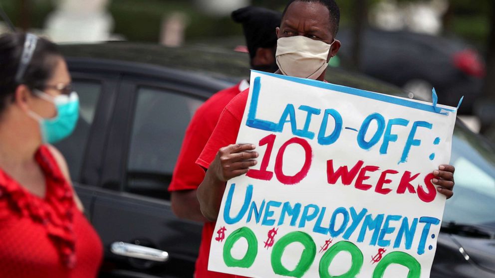 PHOTO: Joseph Louis joins others in a protest asking the state of Florida to fix its unemployment system on May 22, 2020 in Miami Beach, Fla.