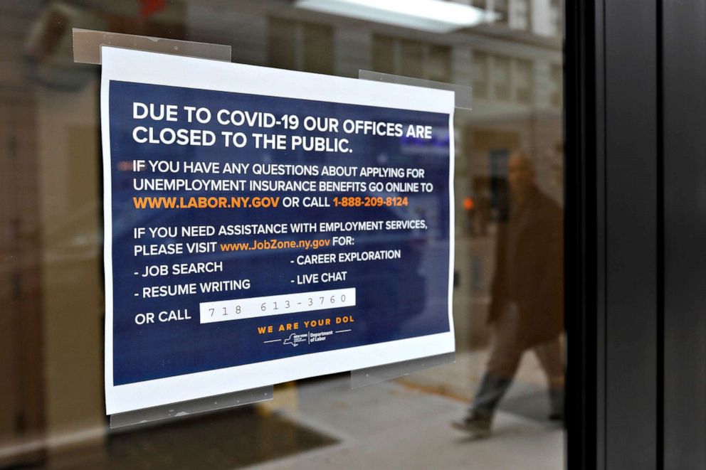 PHOTO: A sign posted on the entrance of the New York State Department of Labor offices, which closed to the public due to the coronavirus outbreak, in the Brooklyn borough of New York City, March 20, 2020.