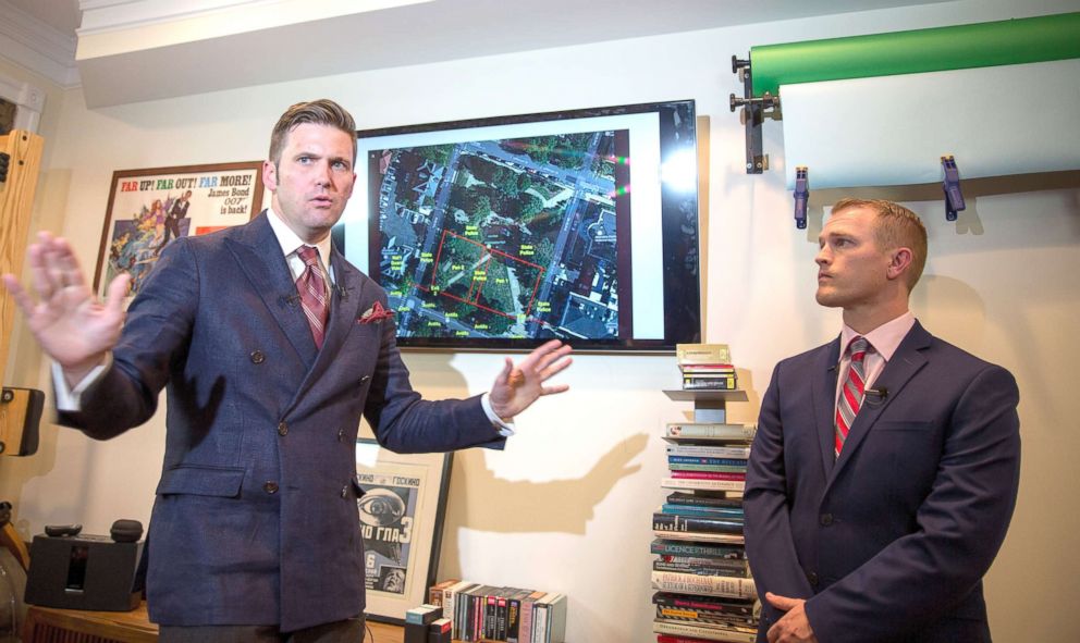 PHOTO: White nationalist Richard Spencer (L) and Nathan Damigo of Identity Evropa speak to select media in a building serving as office space, Aug. 14, 2017 in Alexandria, Va. 