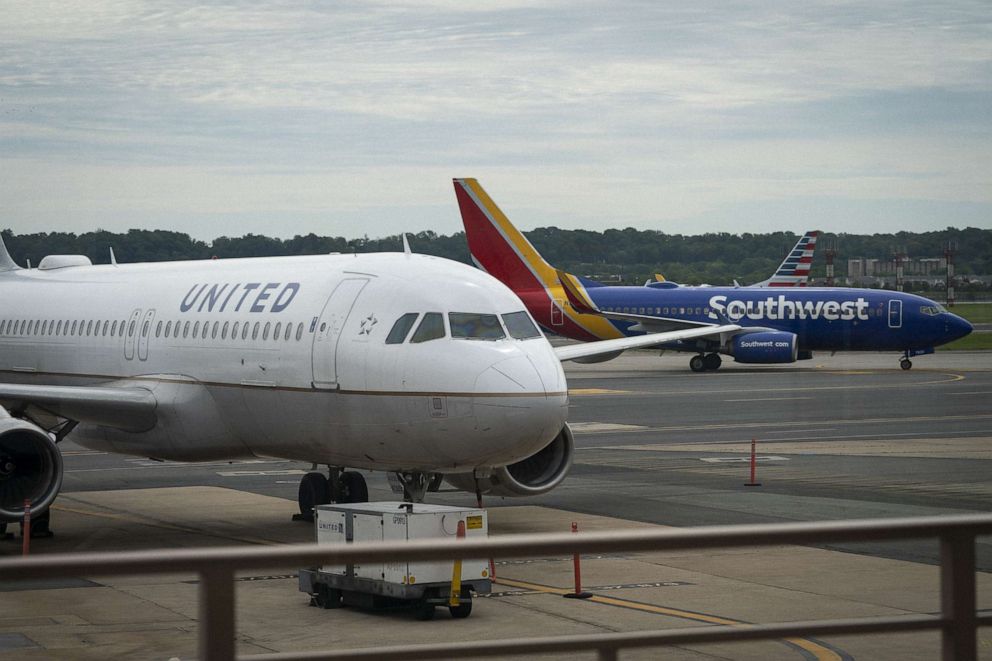 PHOTO: A United Airlines plane sits at a gate Ronald Reagan Washington National Airport, May 5, 2020 in Arlington, Va.