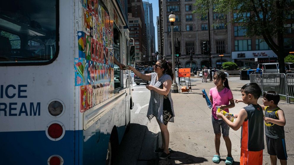 PHOTO: A woman buys ice cream in downtown Chicago, June 14, 2022.