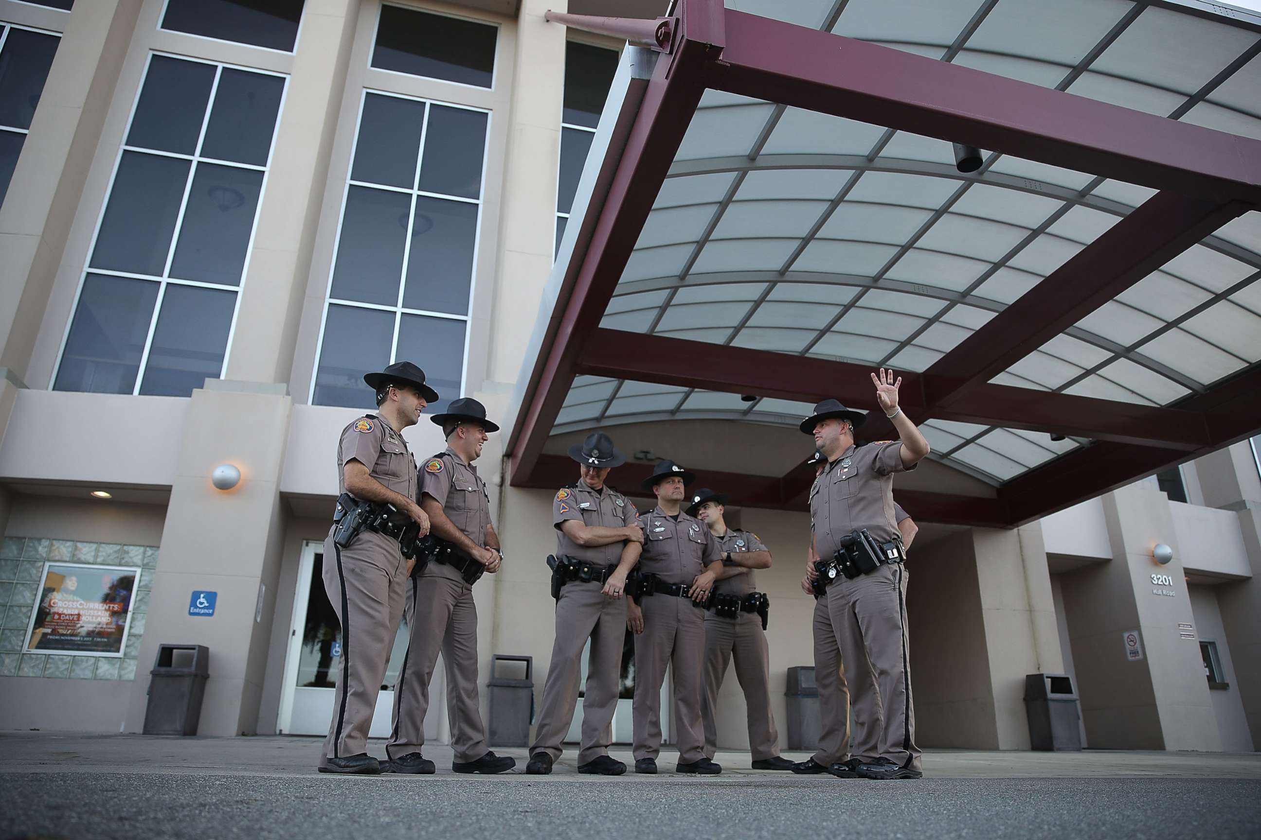 PHOTO: Florida Highway Patrol officers stand outside the Curtis M. Phillips Center for the Performing Arts as they prepare the venue for Thursday's scheduled speech by white nationalist Richard Spencer on Oct. 18, 2017 in Gainesville, Fla. 