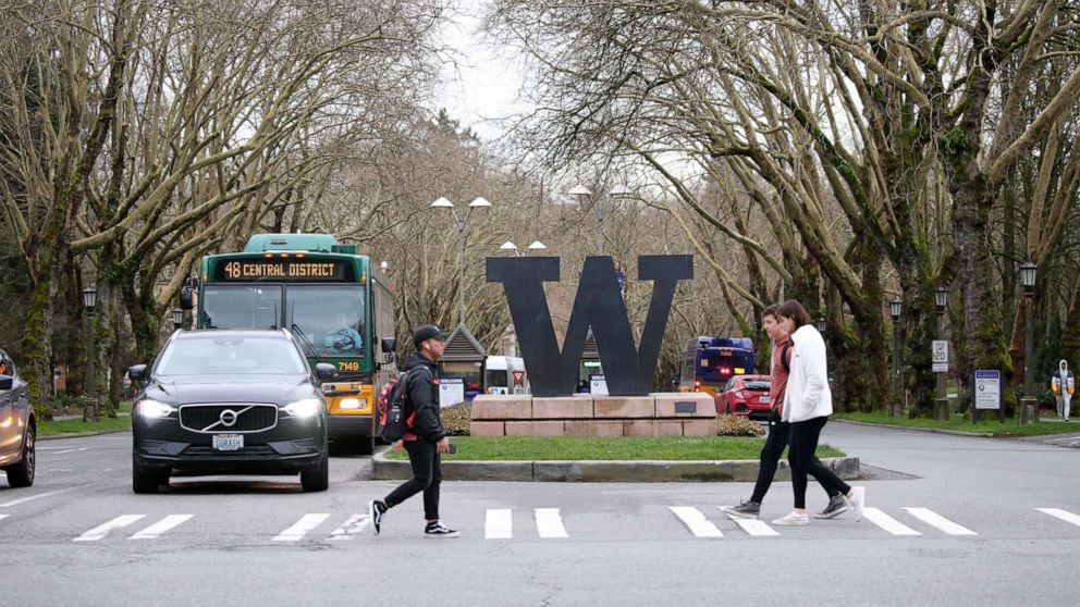 PHOTO: Students at the University of Washington are on campus for the last day of in-person classes on March 6, 2020 in Seattle. The university closed March 9, as a reaction to the novel coronavirus outbreak for the remainder of the winter quarter.