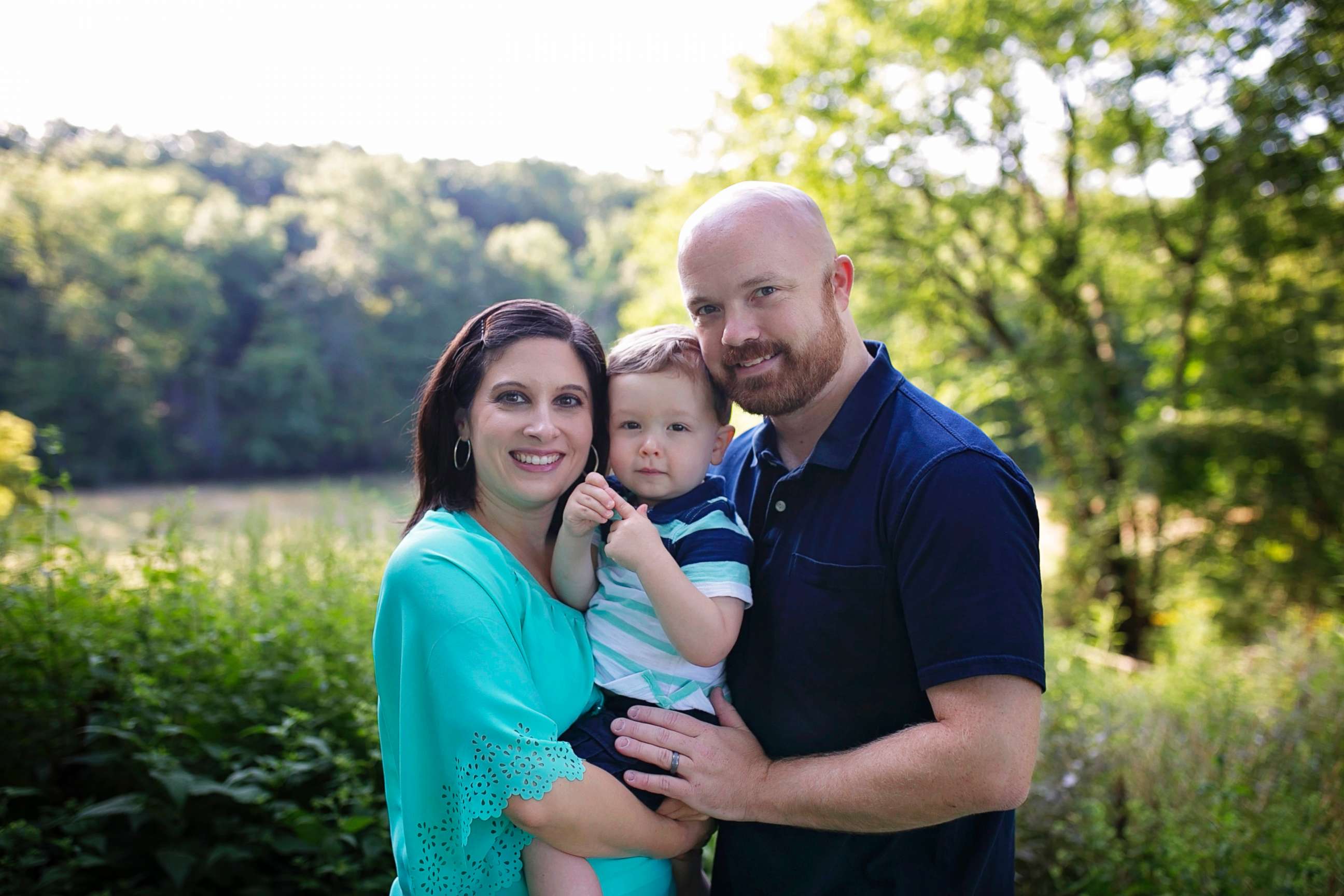 PHOTO: Amber and Elliott Ash hold their son, Ethan, in an undated handout photo.