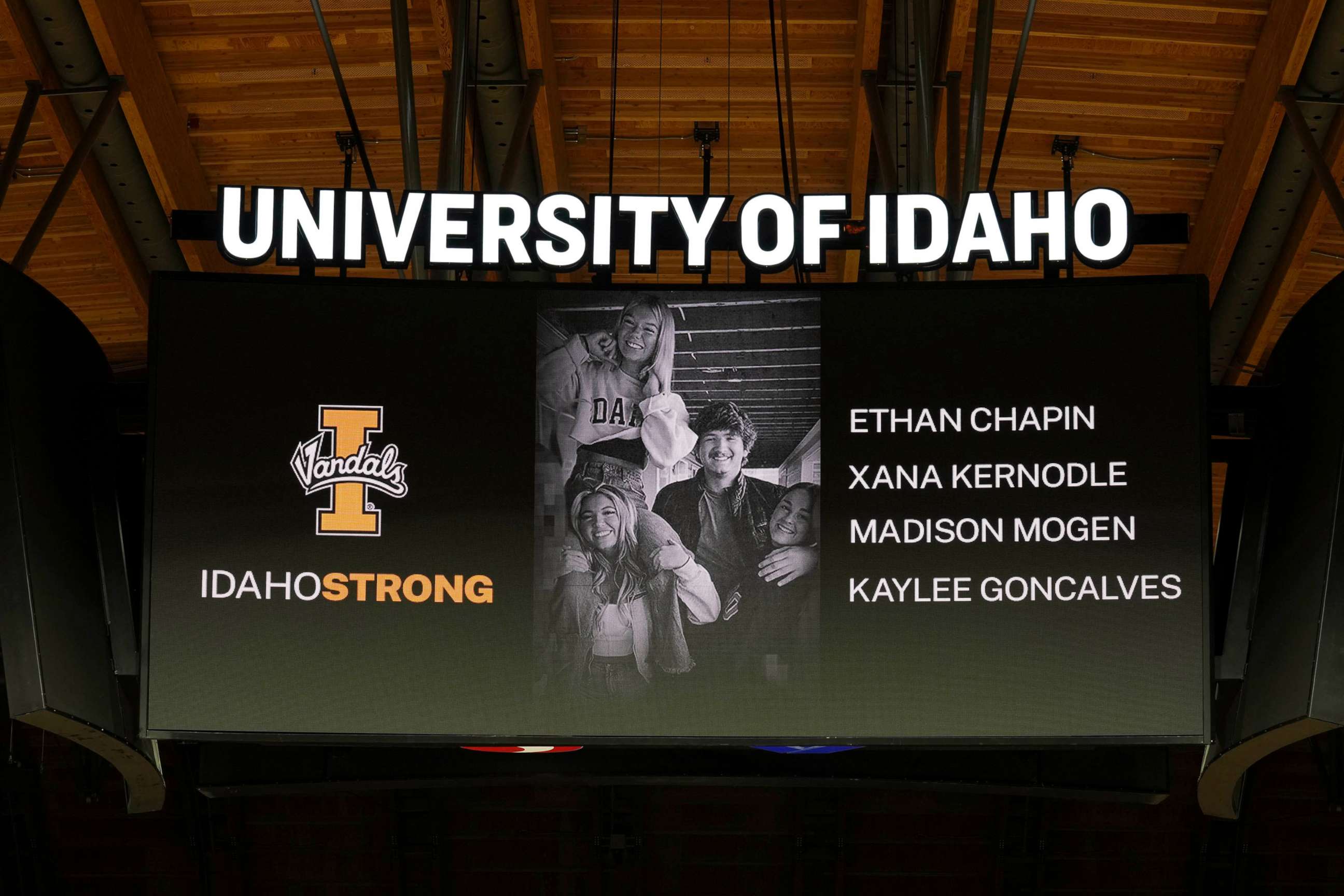 PHOTO: A photo and the names of four University of Idaho students who were killed over the weekend at a residence near campus are displayed during a moment of silence, Wednesday, Nov. 16, 2022, in Moscow, Idaho.