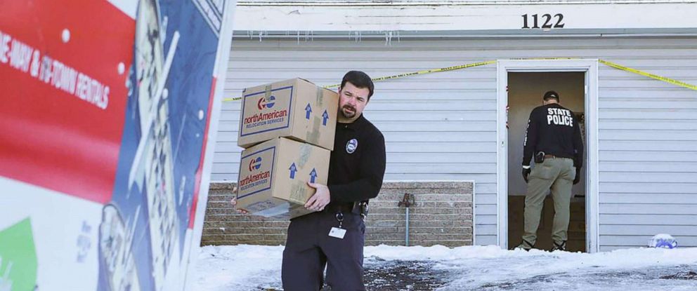 PHOTO: Moscow Police Capt. Anthony Dahlinger, left, and other members of law enforcement packed and removed the personal belongings of four University of Idaho homicide victims from their rental house, on Dec. 7, 2022. 