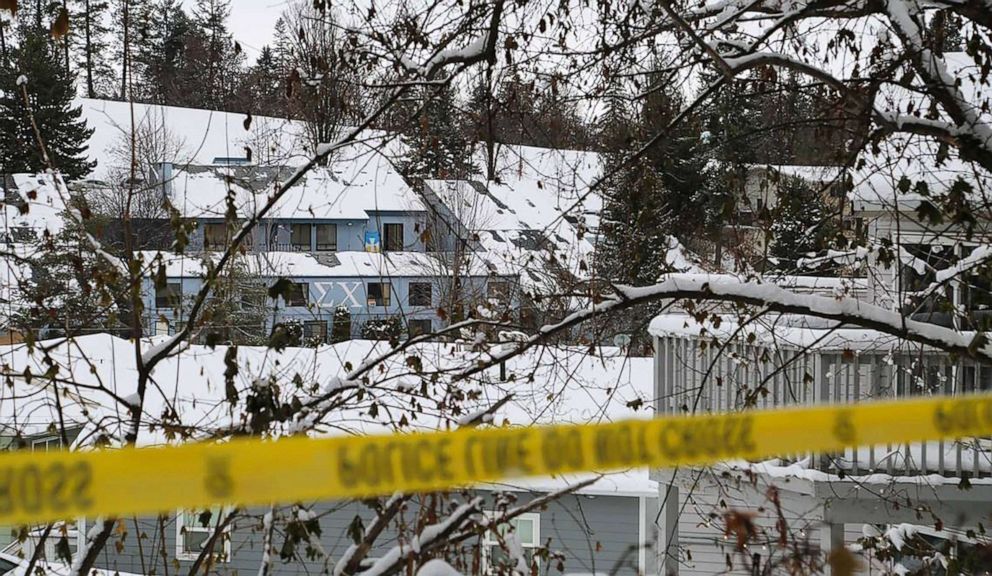 PHOTO: The Sigma Chi fraternity house, left, on Nez Perce Drive can be seen from outside the perimeter of the King Road house where four University of Idaho students were stabbed to death Nov. 13.