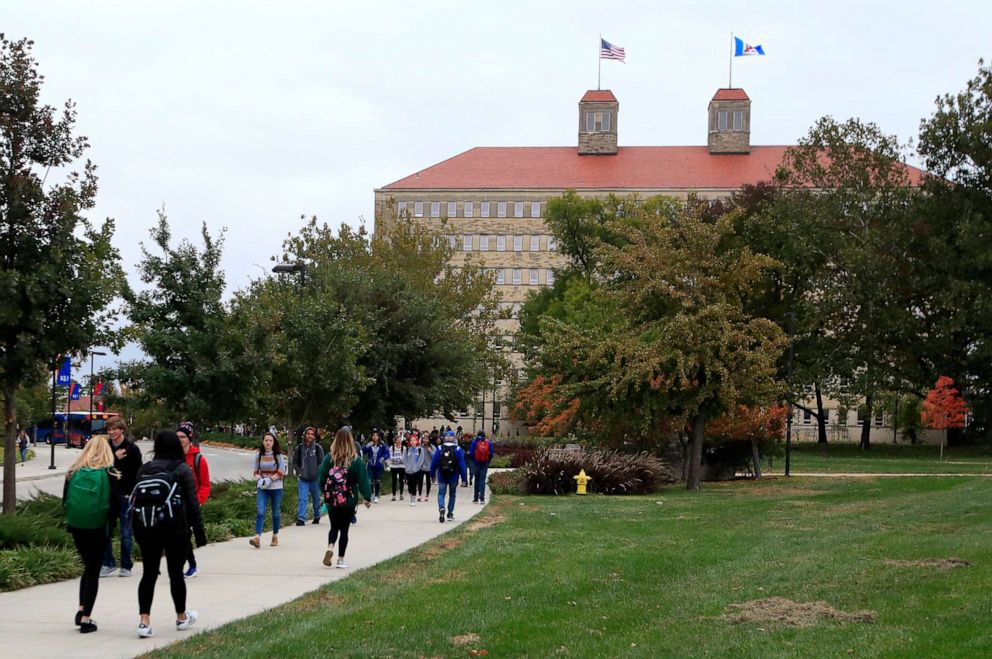 PHOTO: In this Oct. 24, 2019, file photo students walks in front of Fraser Hall on the University of Kansas campus in Lawrence, Kan.