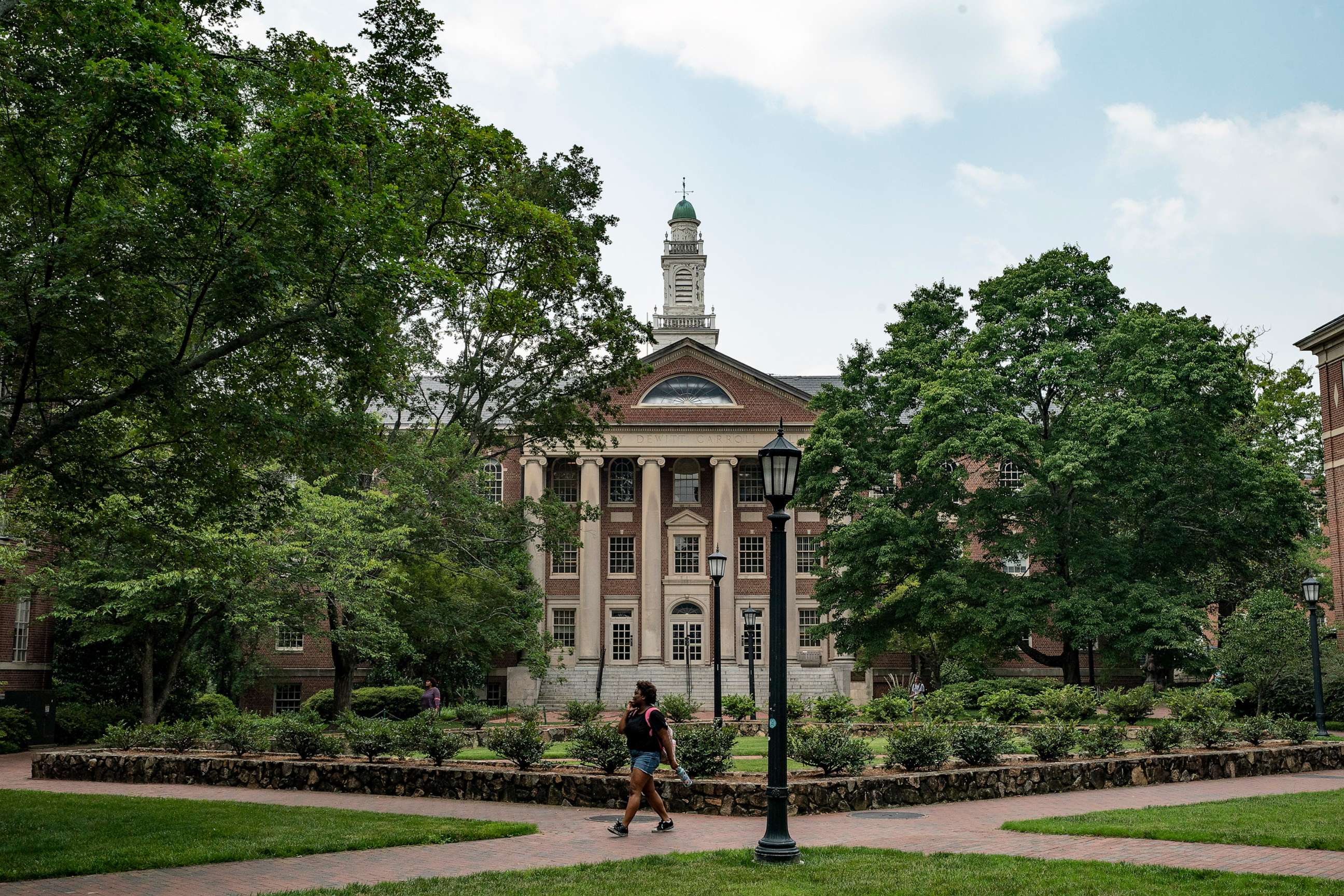 PHOTO: People walk on the campus of the University of North Carolina Chapel Hill on June 29, 2023, in Chapel Hill, N.C.