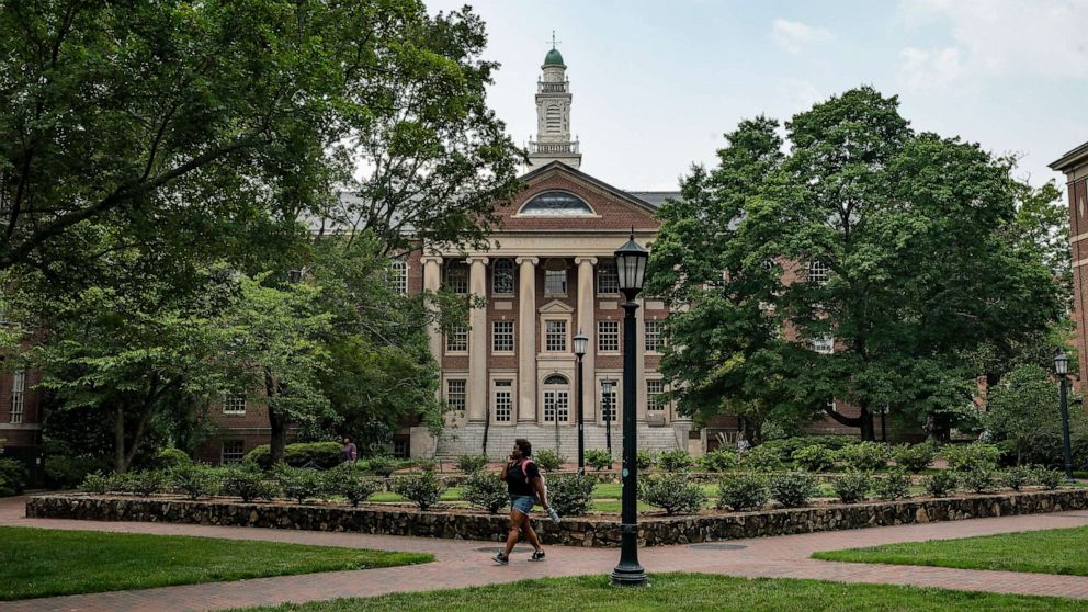 PHOTO: People walk on the campus of the University of North Carolina Chapel Hill on June 29, 2023, in Chapel Hill, N.C.