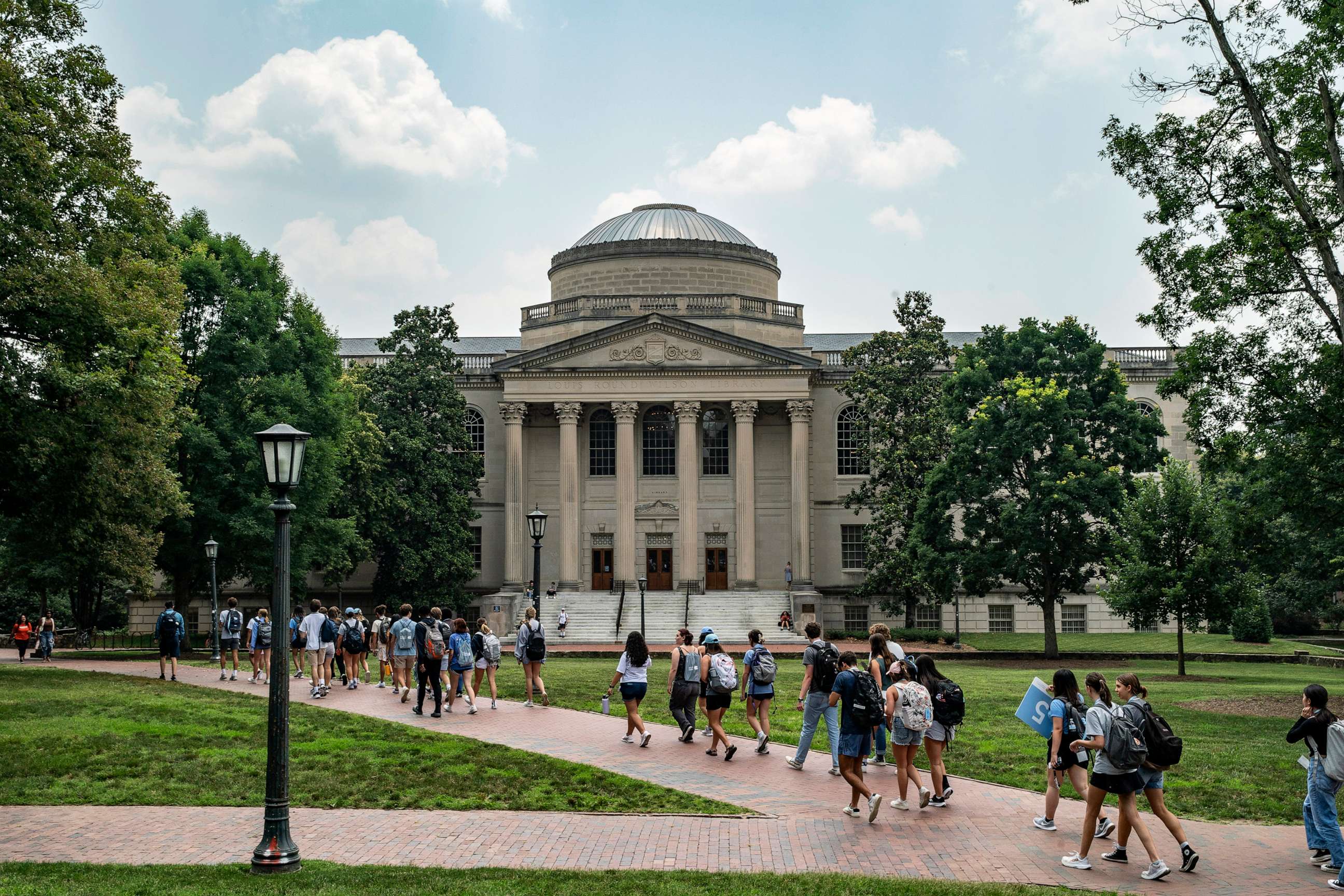 PHOTO: People walk on the campus of the University of North Carolina Chapel Hill on June 29, 2023, in Chapel Hill, N.C.