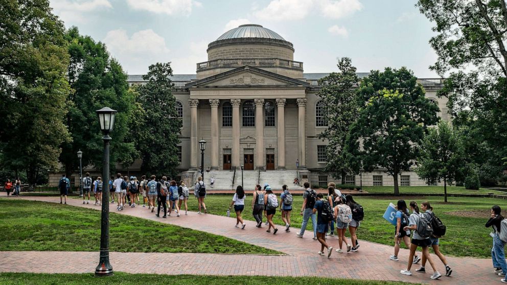 PHOTO: People walk on the campus of the University of North Carolina Chapel Hill on June 29, 2023, in Chapel Hill, N.C.