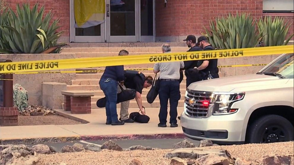 PHOTO: In this screen grab from a video, police work near the scene where a person was killed on the University of Arizona campus in Tucson, Ariz.