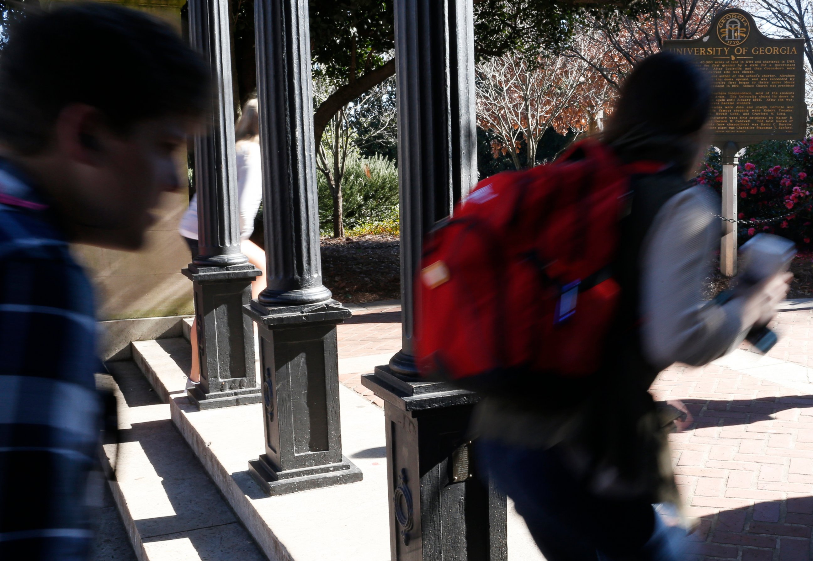 PHOTO: In this Jan. 9, 2019, file photo University of Georgia undergraduate students avoid walking under the university arch on the first day of the spring semester in Athens, Ga.