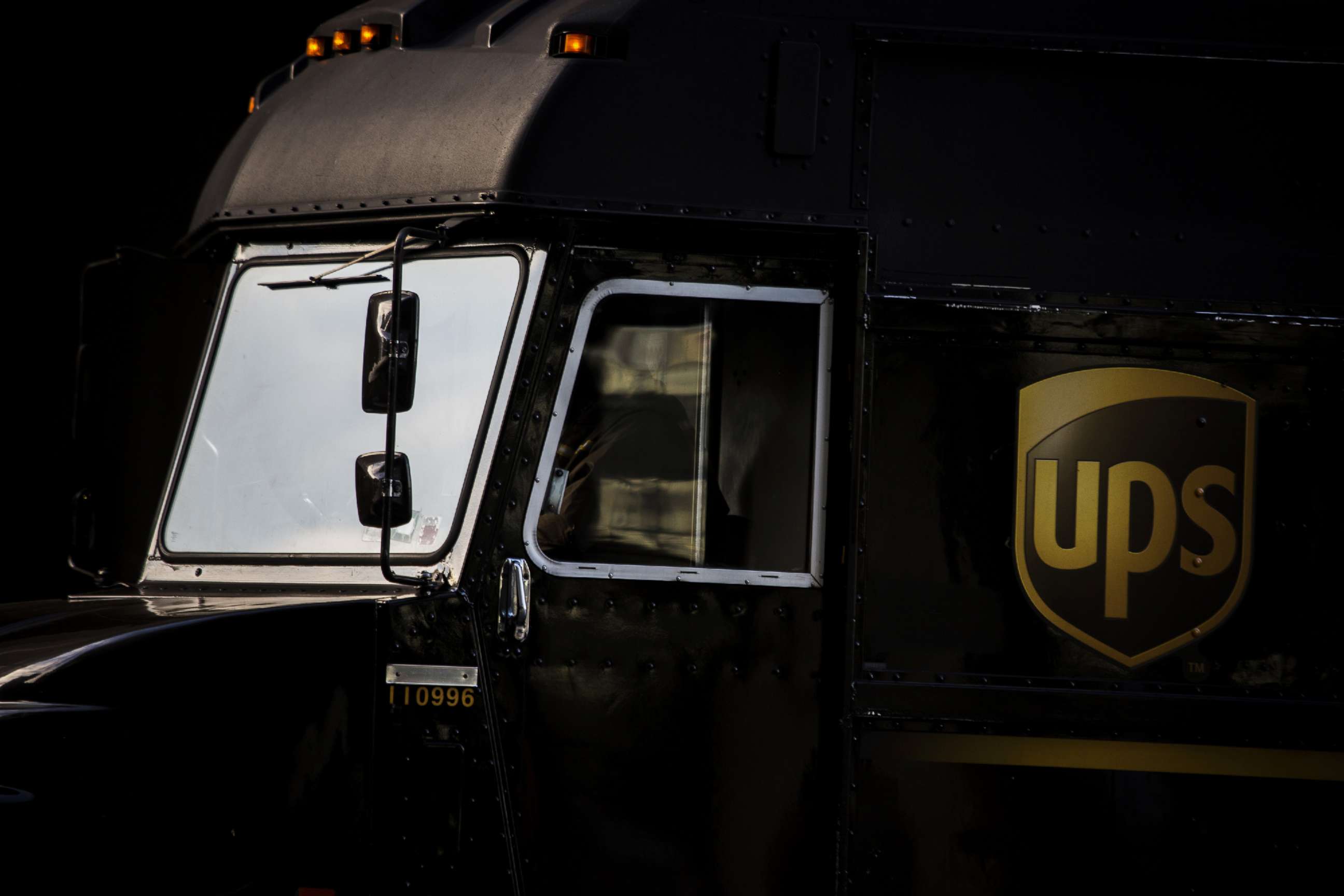PHOTO: An employee drives a delivery truck out of a United Parcel Service Inc. (UPS) distribution facility in New York, Nov. 30, 2015.