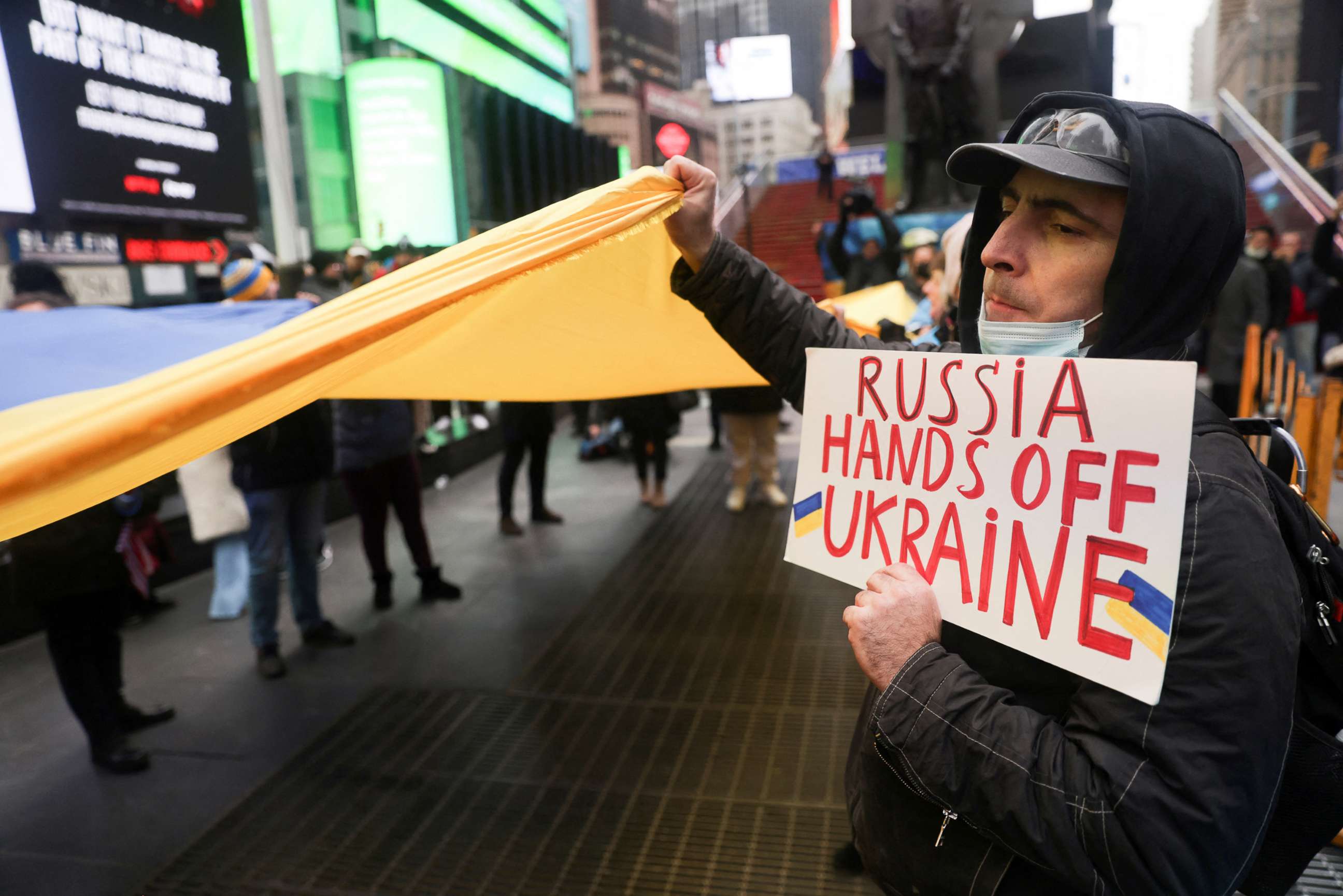 PHOTO: People take part in a protest against Russia's military operation in Ukraine, in Times Square, in New York, Feb. 24, 2022.