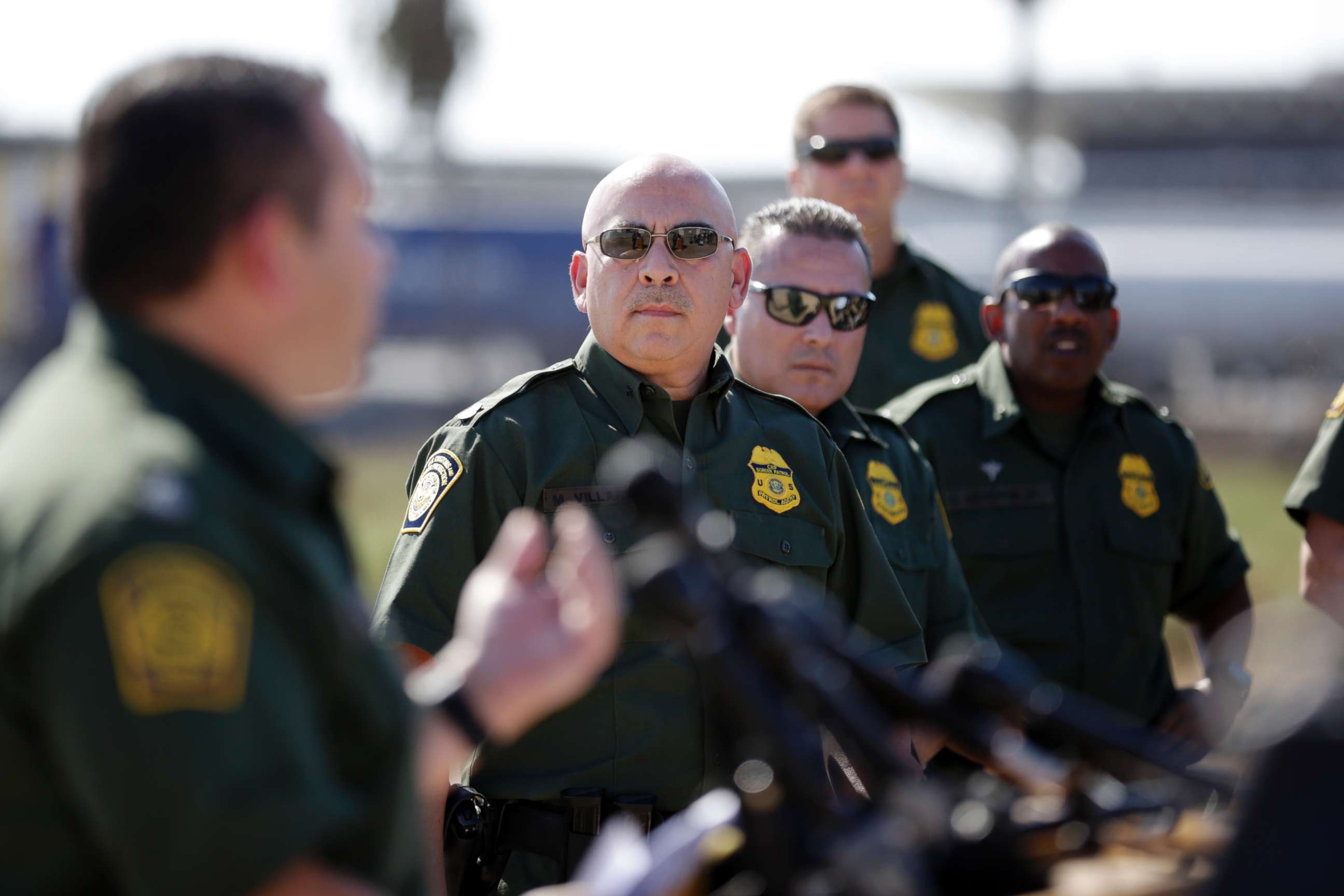 PHOTO: Roy Villarreal, acting Chief Patrol Agent of the Border Patrol, San Diego Sector, left, speaks to other Border Patrol agents on in front of secondary fencing along the border separating San Diego from Tijuana, Mexico, Sept. 26, 2017, in San Diego.