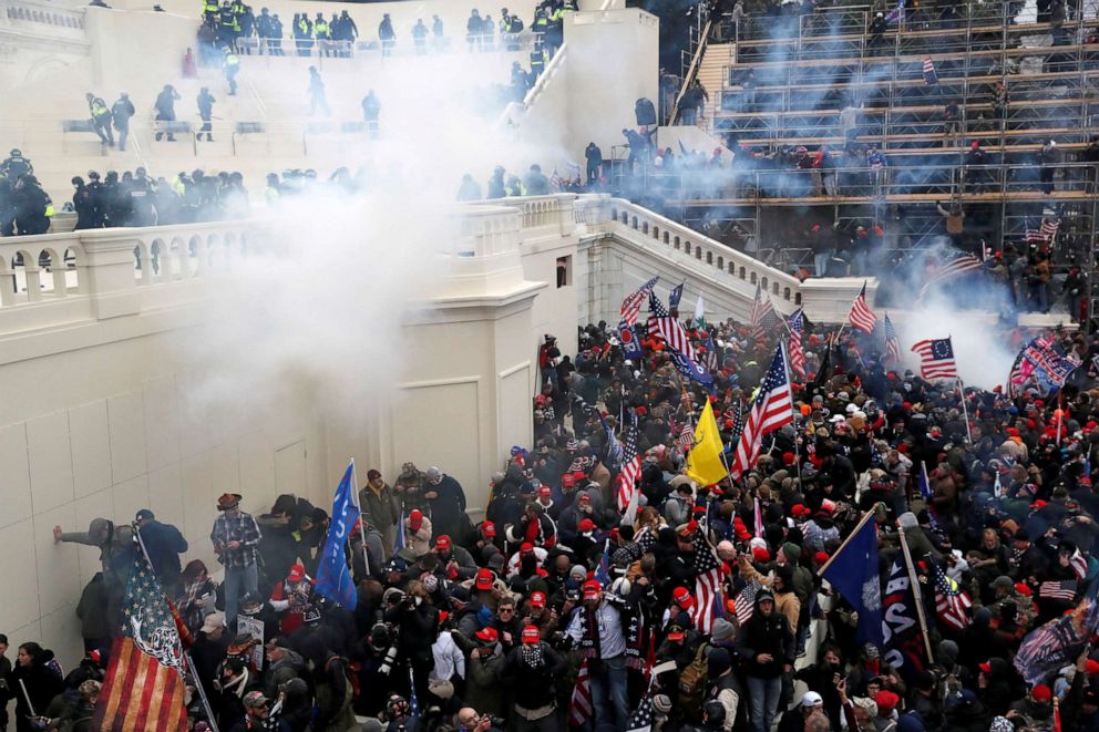 PHOTO: Police release tear gas into a crowd of U.S. President Donald Trump's supporters who are protesting the certification of the 2020 presidential election results by Congress at the U.S. Capitol Building in Washington, D.C., on Jan. 6, 2021.