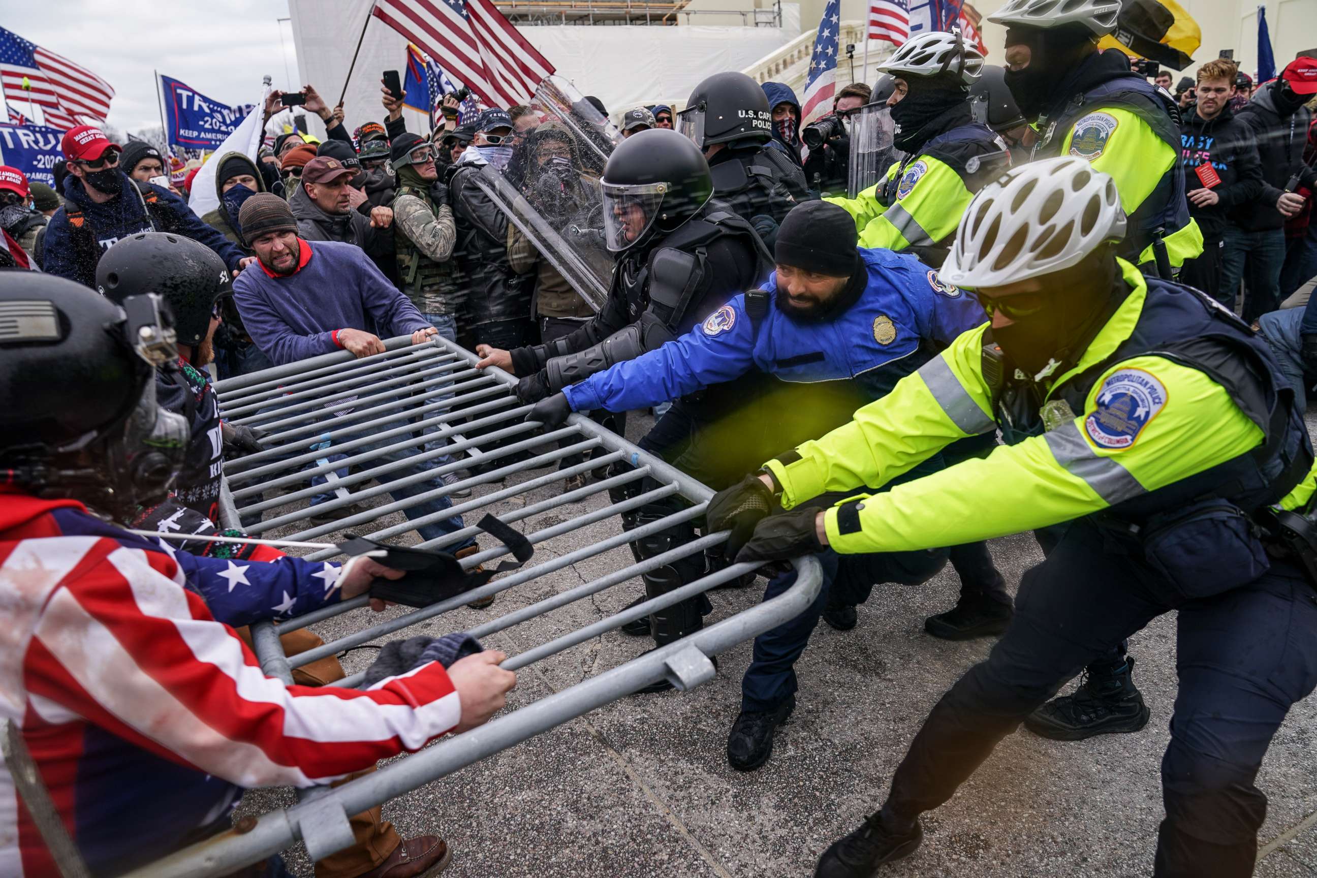 PHOTO: Rioters try to break through a police barrier at the U.S. Capitol in Washington, D.C., on Jan. 6, 2021.