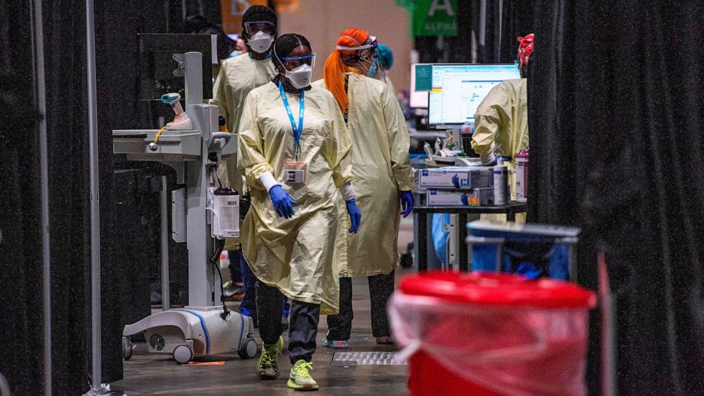 PHOTO: Inside the hot zone medical staff monitor and treat sick patients infected with the Covid-19 virus at the UMASS Memorial DCU Center Field Hospital in Worcester, Massachusetts on January 13, 2021.