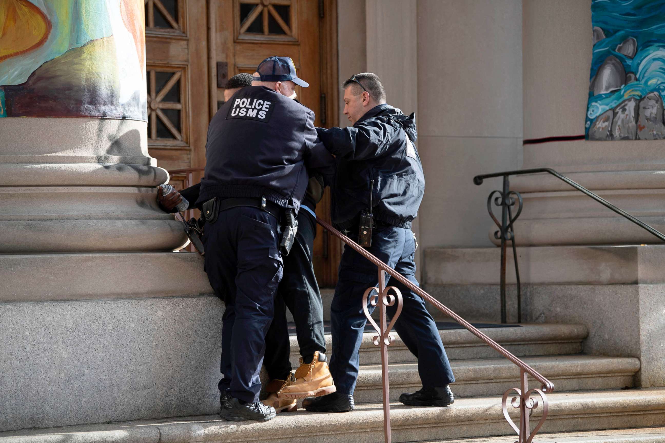 PHOTO: In this Dec. 17, 2021, file photo, a man is apprehended by U.S. Marshals Services in New York.