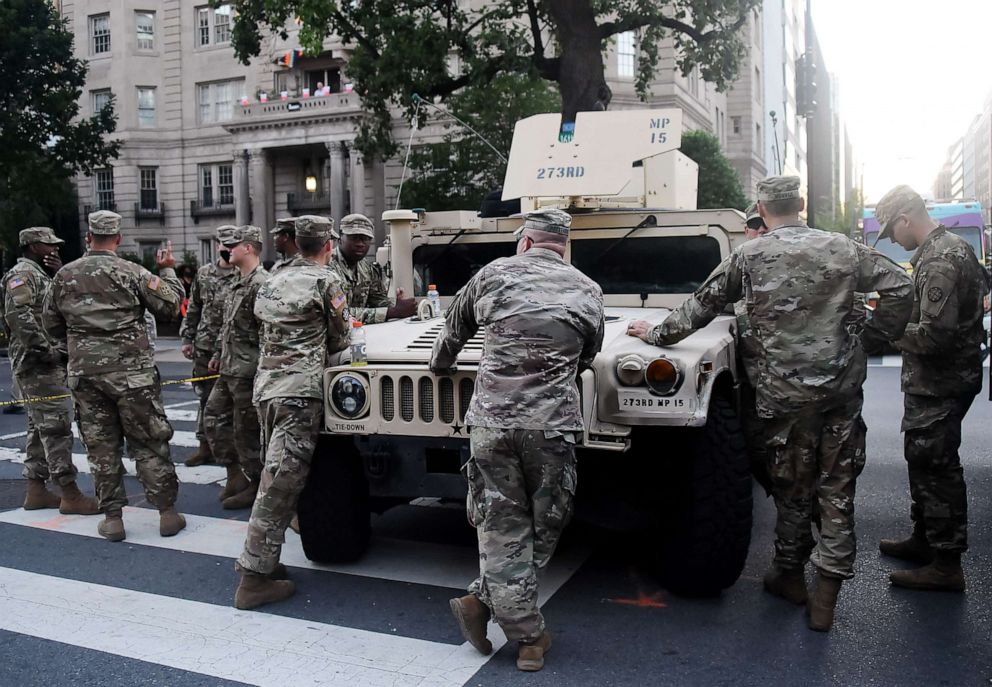 PHOTO: Members of the U.S. National Guard stand near the White House as people protest against racism and police brutality in Washington, D.C., on June 7, 2020.