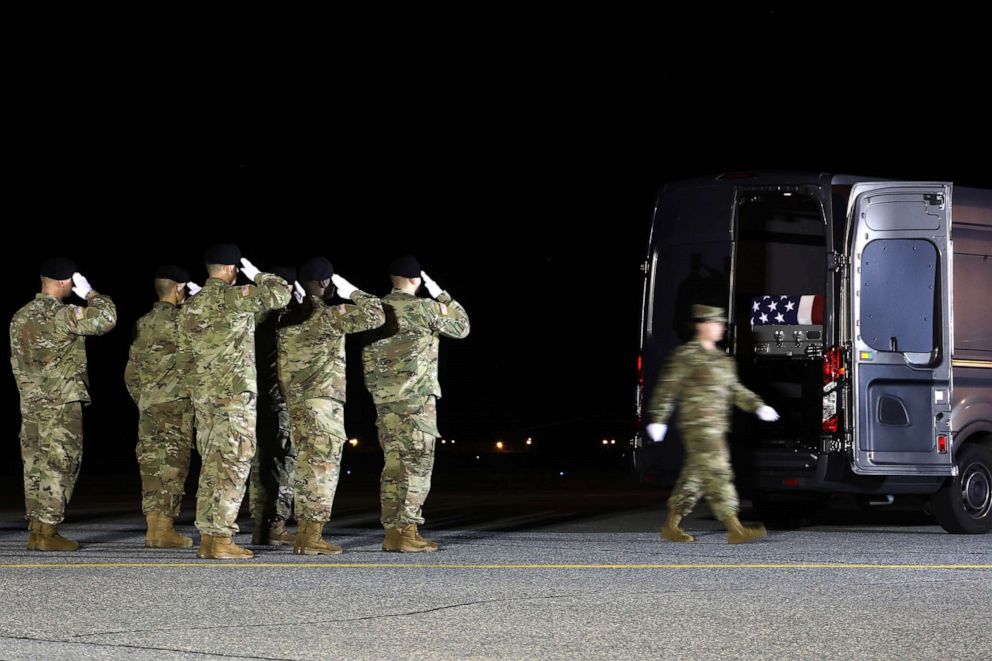 PHOTO: A U.S. Army carry team salutes after loading the remains of U.S. Army Sgt. Maj. James G. Sartor into a mortuary van during a dignified transfer at Dover Air Force Base, July 15, 2019, in Dover, Delaware.