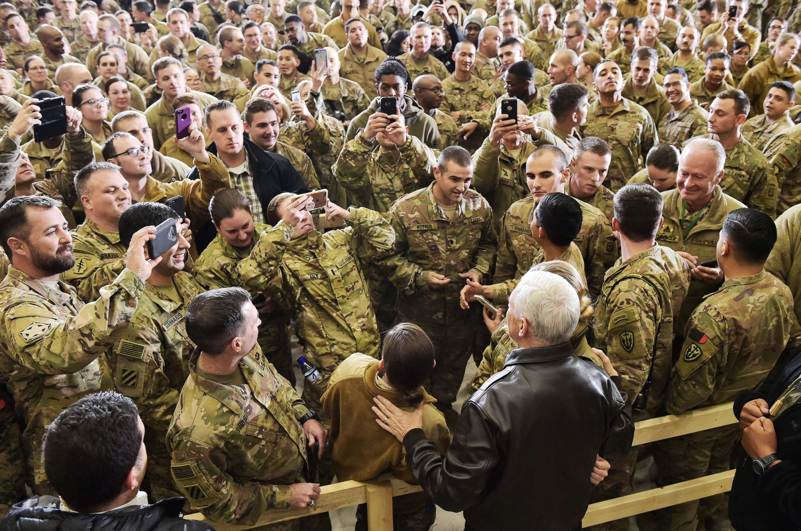PHOTO: Vice President Mike Pence poses for photos with troops after addressing them in a hangar at Bagram Air Field in Afghanistan on Dec. 21, 2017.