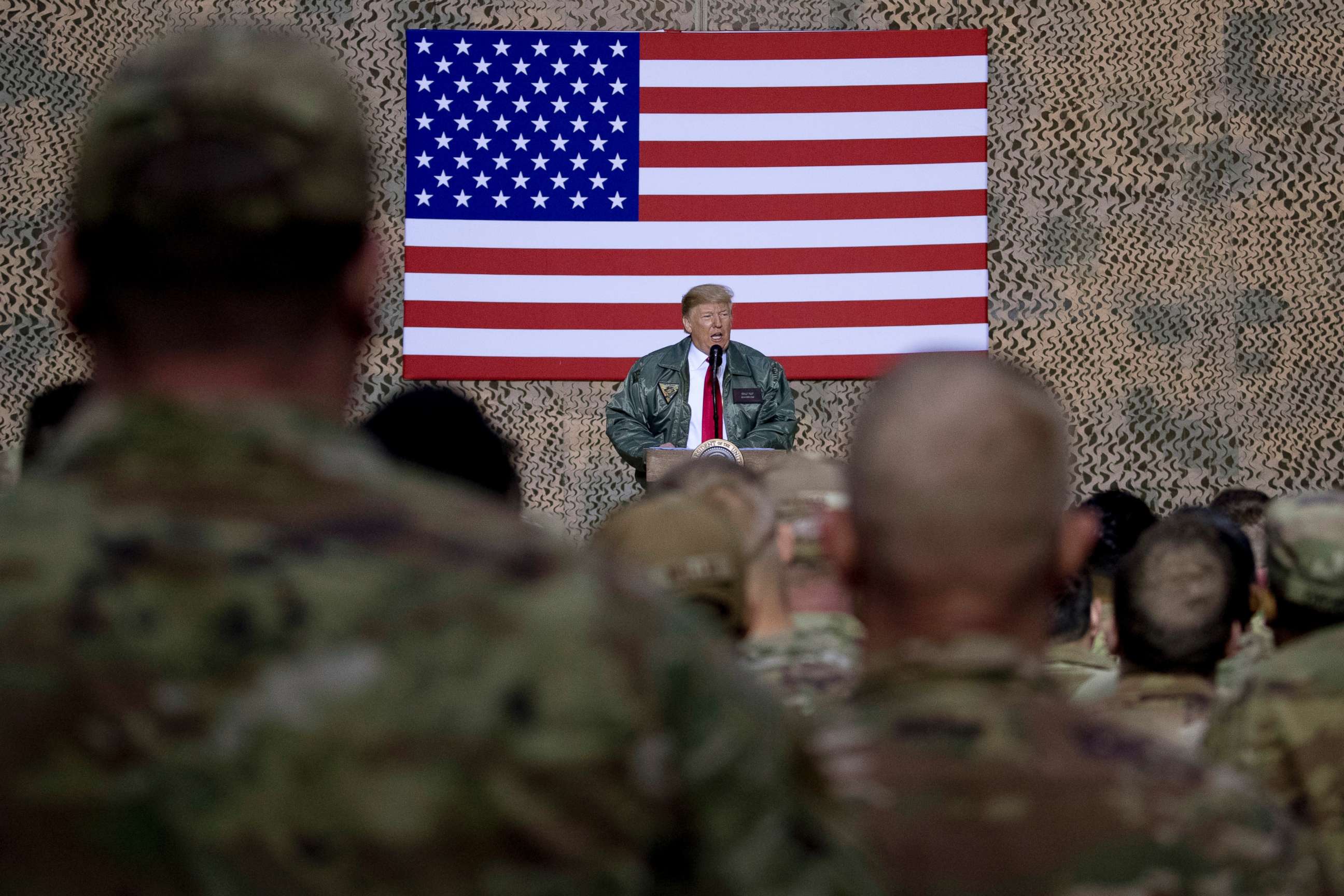PHOTO: President Donald Trump speaks to members of the military at a hangar rally at Al Asad Air Base, Iraq, Dec. 26, 2018.